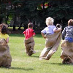 children doing a potato sack race