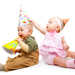two babies celebrating first birthday