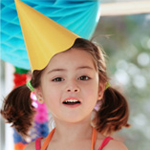 girl wearing party hat
